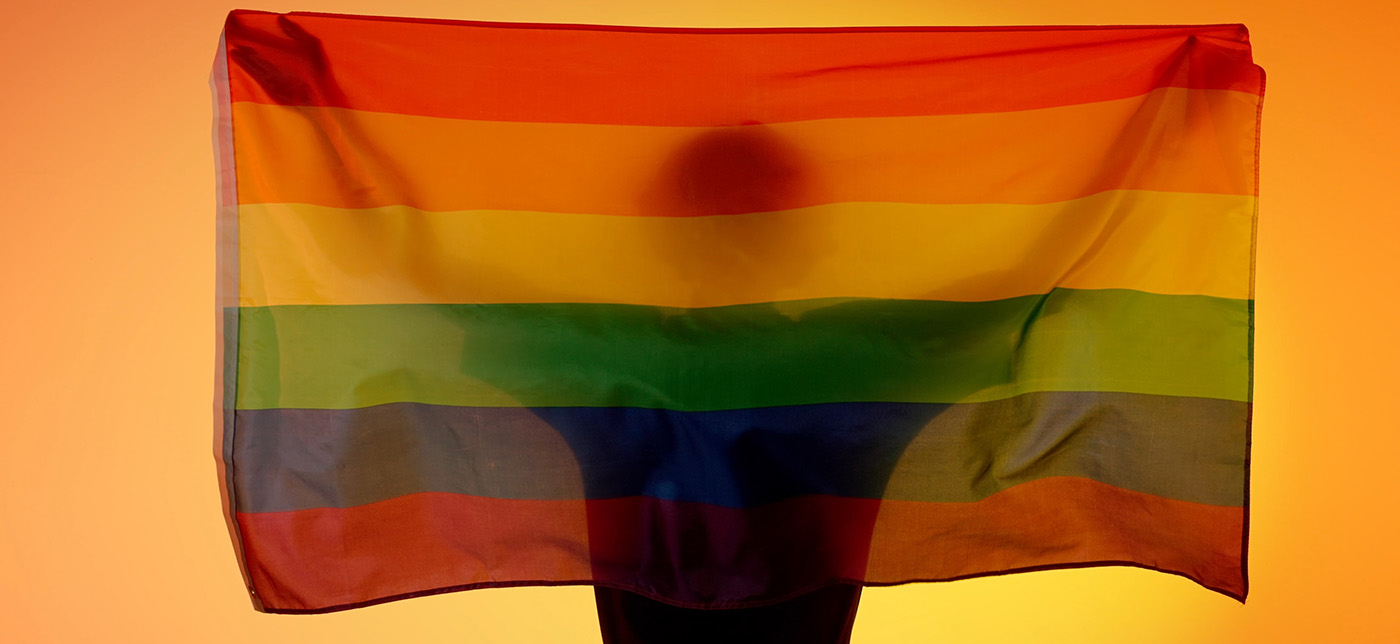 a group of people's arms after donatging with rainbow bandages